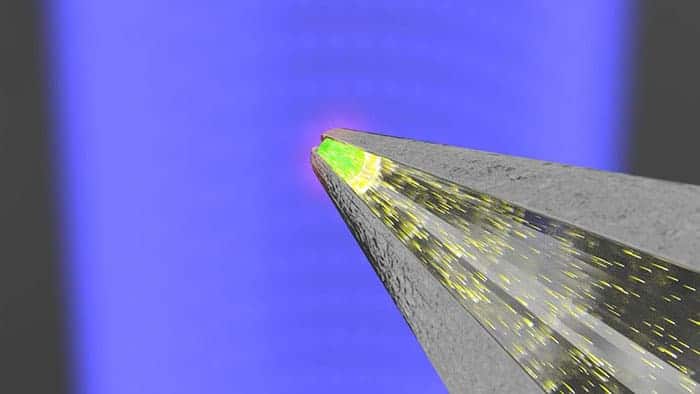 Artist's impression of the microscale X-ray detector emitting light down a thin optical fibre