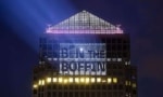 Bin the Boffin projected onto a building