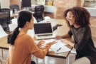 two people talking at a table