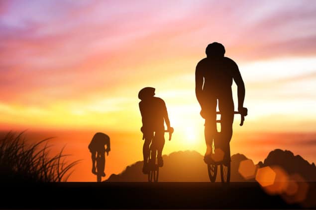 Cyclists climbing a hill