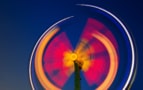 A photograph of a fairground at night