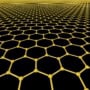 Artist's image of a graphene lattice, showing the atoms as yellow balls and the edges of the lattice as yellow lines