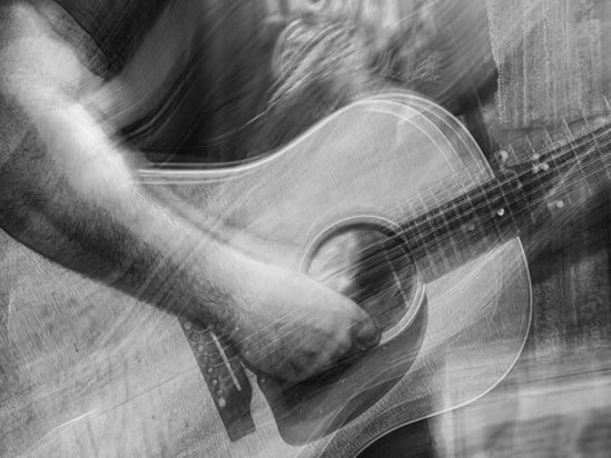 black and white artwork of musician playing guitar