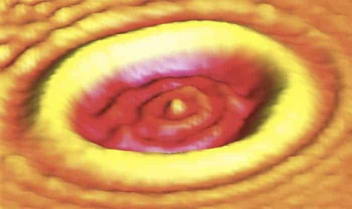 Images showing scanning-tunnelling-microscope image showing circular quantum interference patterns resulting from the confined Dirac fermions