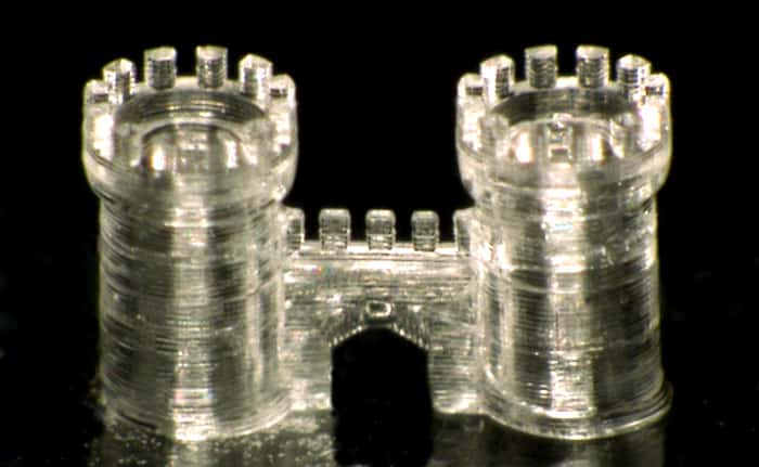 Photograph of the microscale glass castle made by 3D printing with liquid glass