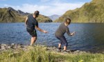 Photo of people skipping stones