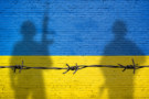 Ukraine flag with soldier shadows